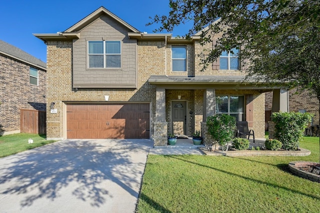 1712 Uhland Dr, Leander, TX 78641 - view of front of property with driveway, a front lawn, a garage, and brick siding