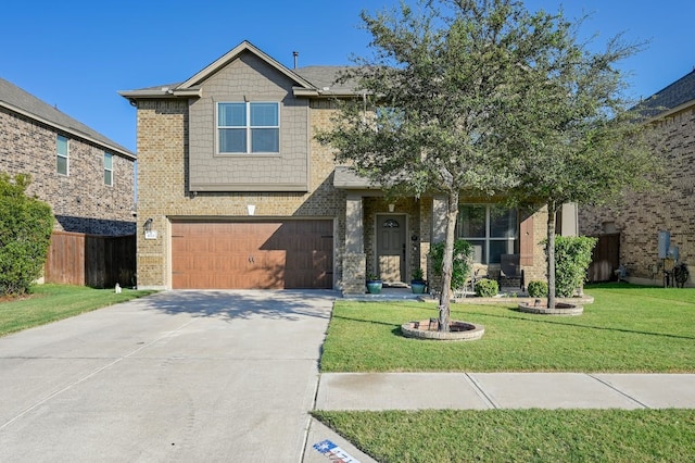 view of front of property featuring a garage and a front yard