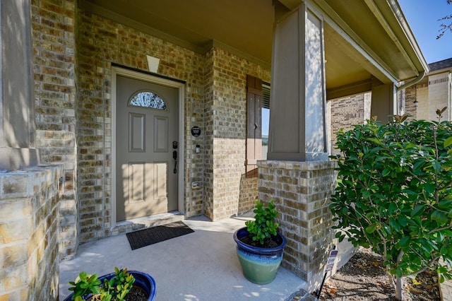 doorway to property with a porch