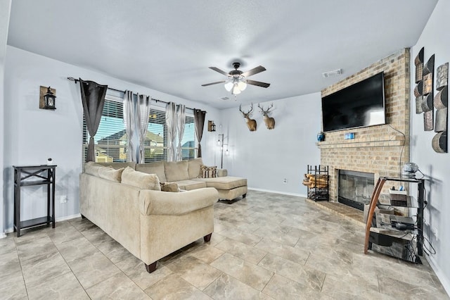 living room featuring a fireplace and ceiling fan