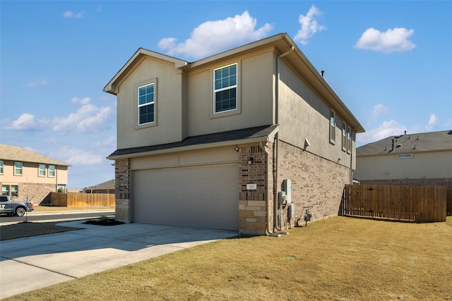 view of front of house with a garage and a front yard