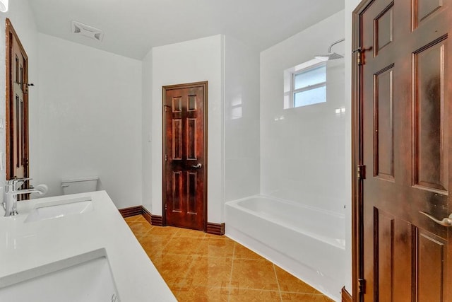 full bathroom with tile patterned flooring,  shower combination, vanity, and toilet