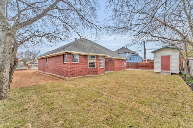 back of property featuring a shed and a lawn