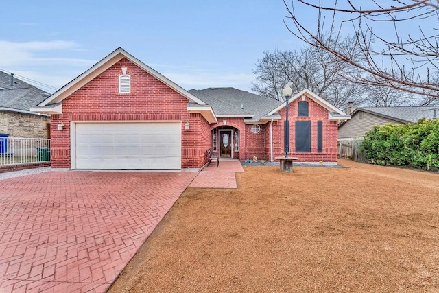 view of front facade with a garage and a front yard