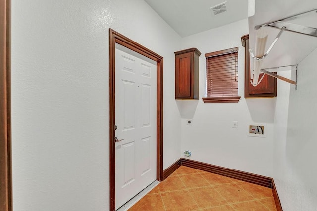 laundry area featuring cabinets, hookup for a washing machine, and hookup for an electric dryer