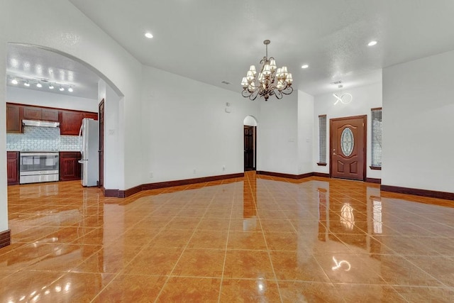 foyer featuring a chandelier