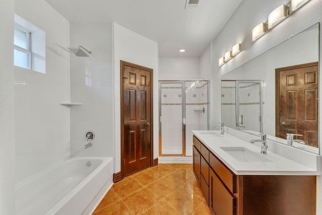 bathroom with vanity, tile patterned floors, and shower with separate bathtub