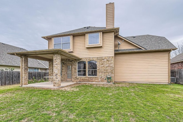 4312 Clear Meadow Pl, Round Rock, TX 78665 - back of property with a patio, a chimney, and brick siding