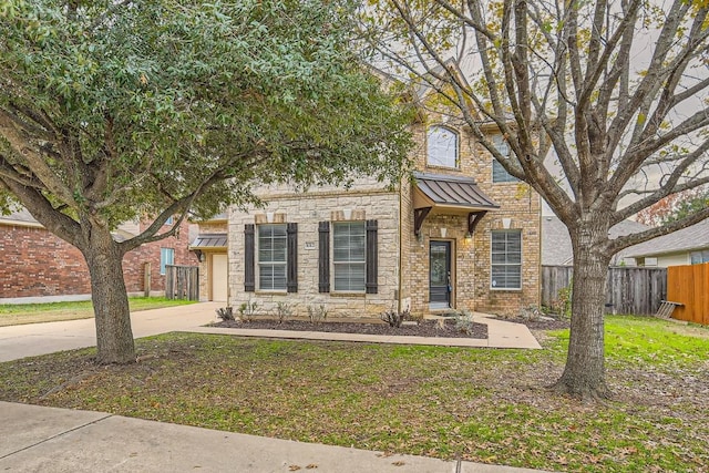 4312 Clear Meadow Pl, Round Rock, TX 78665 - view of front of house with a standing seam roof, stone siding, concrete driveway, a garage, and metal roof