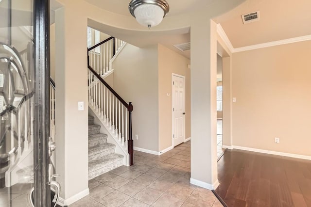 4312 Clear Meadow Pl, Round Rock, TX 78665 - tiled foyer entrance featuring stairs, baseboards, and ornamental molding