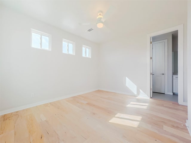 spare room featuring ceiling fan and light wood-type flooring