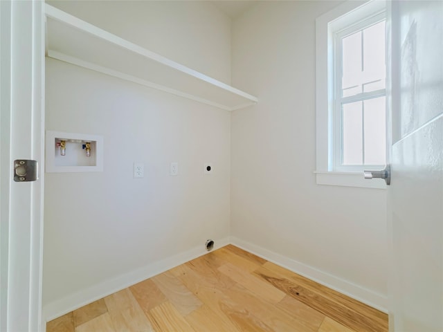 washroom featuring wood-type flooring, hookup for a washing machine, and electric dryer hookup