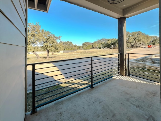 balcony featuring a rural view