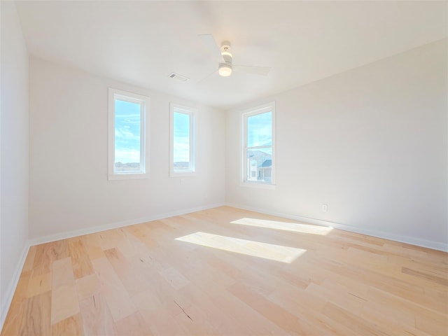 spare room featuring ceiling fan and light wood-type flooring