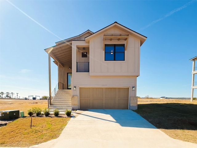 view of front of home with a garage and a front yard