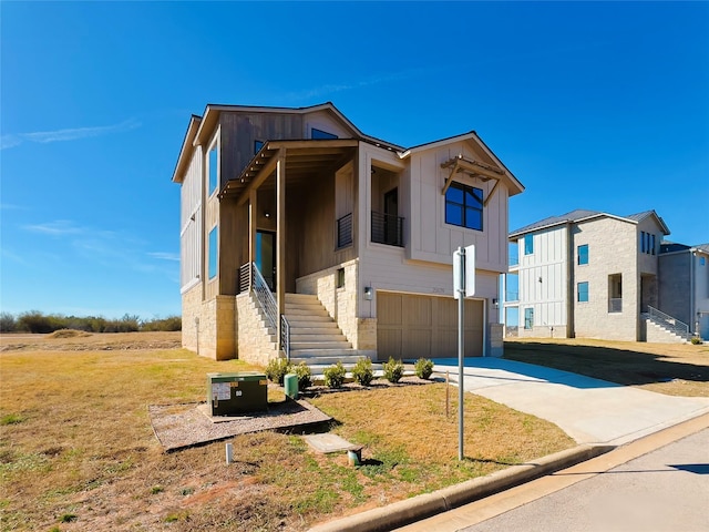 view of front of home with a garage and a front yard