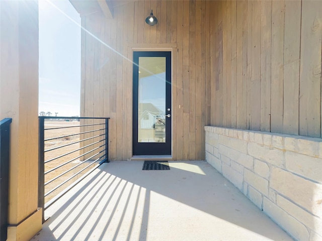 doorway to property featuring a balcony