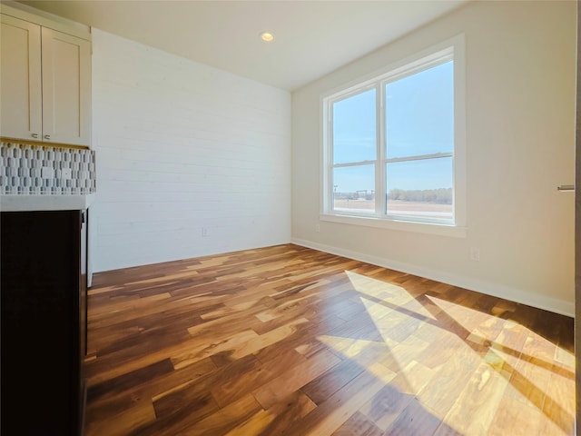 unfurnished living room featuring hardwood / wood-style floors