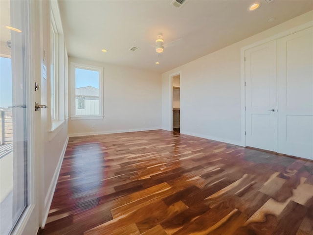 empty room with dark wood-type flooring