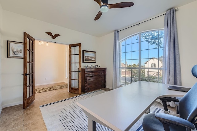 home office featuring light tile patterned floors, french doors, and ceiling fan