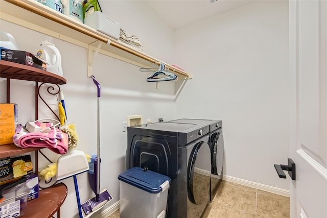 laundry room with washing machine and clothes dryer