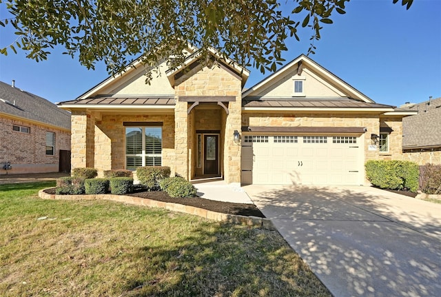 view of front of house with a garage and a front yard