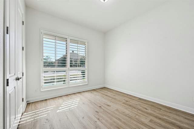 spare room with light hardwood / wood-style floors