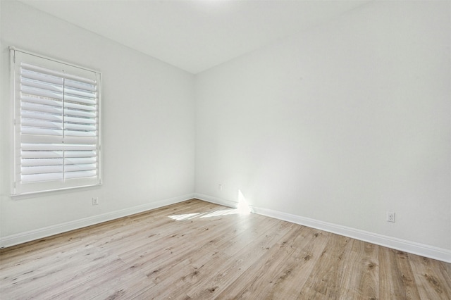 spare room with light wood-type flooring