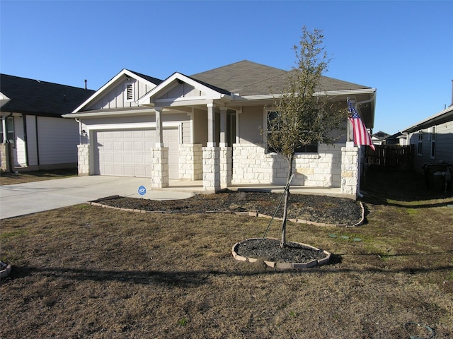 view of front of house featuring a garage and a front lawn