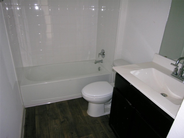 full bathroom featuring vanity, hardwood / wood-style floors, shower / tub combination, and toilet