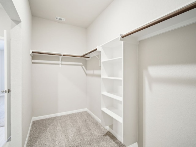 walk in closet featuring carpet floors and visible vents