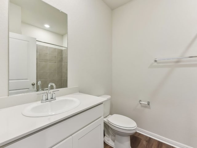 249 Boatright Blvd, Jarrell, TX 76537 - bathroom with wood finished floors, toilet, vanity, baseboards, and a shower