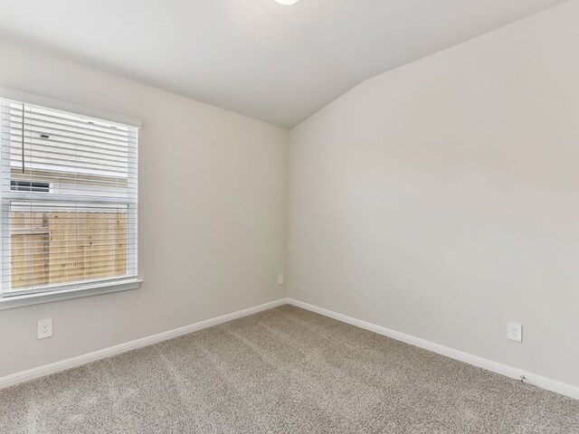 249 Boatright Blvd, Jarrell, TX 76537 - carpeted empty room featuring vaulted ceiling and baseboards