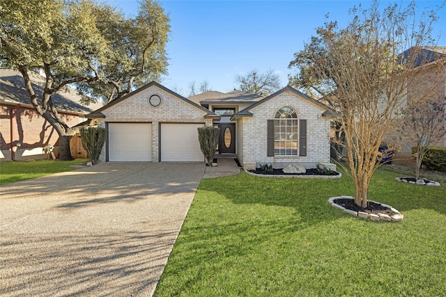 ranch-style house featuring a garage and a front yard