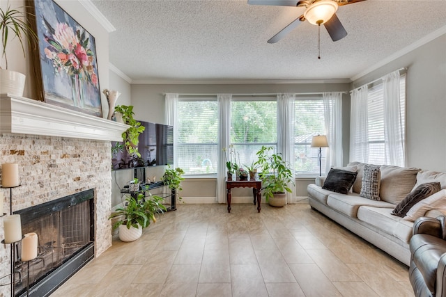 living room with a healthy amount of sunlight, a fireplace, and a textured ceiling