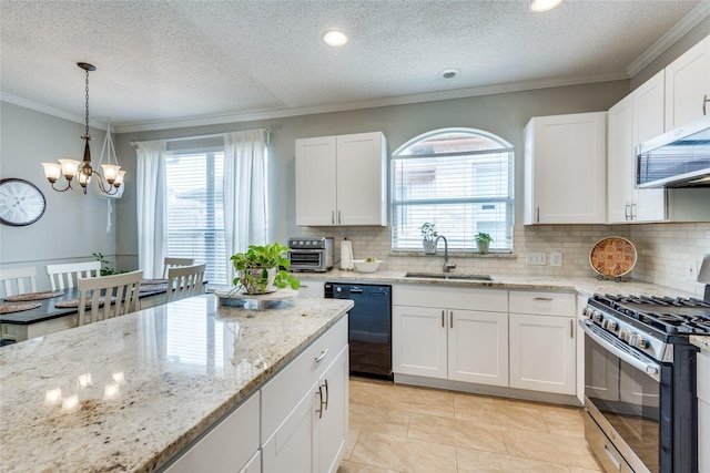 kitchen with sink, a textured ceiling, appliances with stainless steel finishes, decorative backsplash, and white cabinets