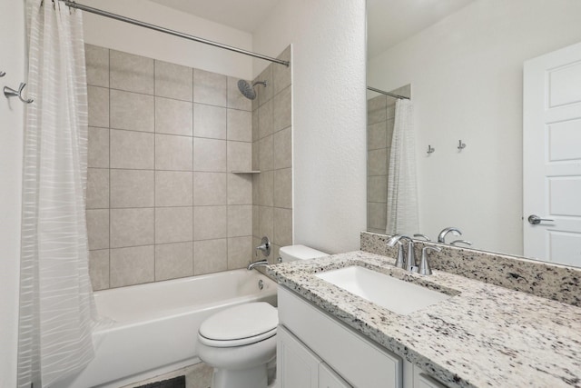 full bathroom with vanity, shower / tub combo with curtain, and toilet