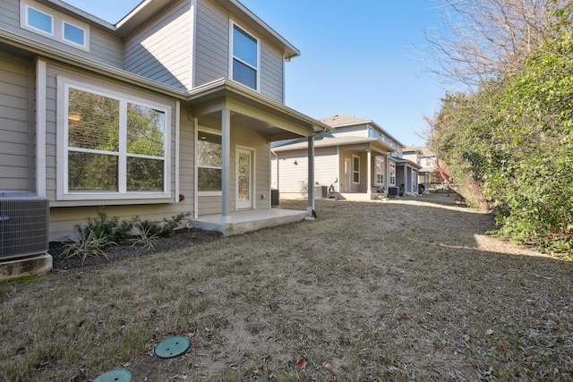 back of house featuring a patio and central AC unit