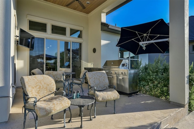 view of patio / terrace with a grill and ceiling fan