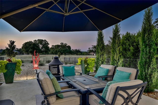 view of patio terrace at dusk