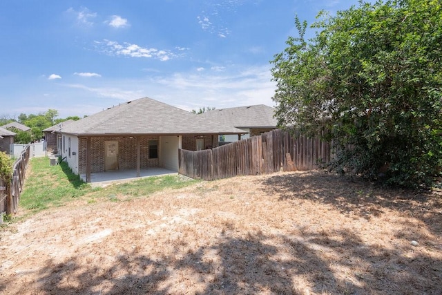 back of property with a patio