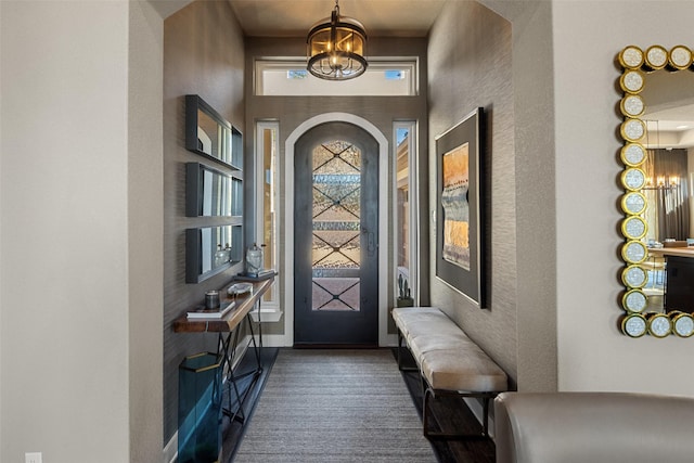 entrance foyer with an inviting chandelier and a high ceiling