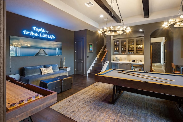 game room featuring bar, pool table, dark wood-type flooring, and beamed ceiling