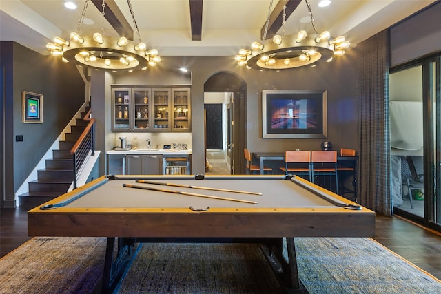 playroom with dark wood-type flooring, wet bar, beam ceiling, and billiards