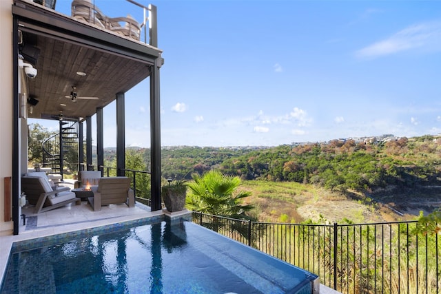 view of pool with ceiling fan