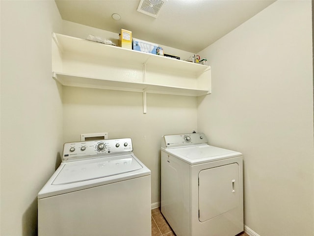 clothes washing area featuring separate washer and dryer