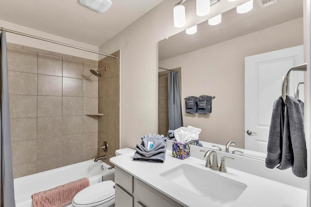 full bath featuring visible vents, a textured wall, toilet, vanity, and  shower combination