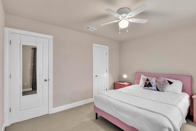 bedroom with light carpet, a ceiling fan, visible vents, and baseboards