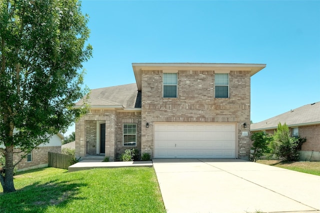 view of front of home with a garage and a front yard