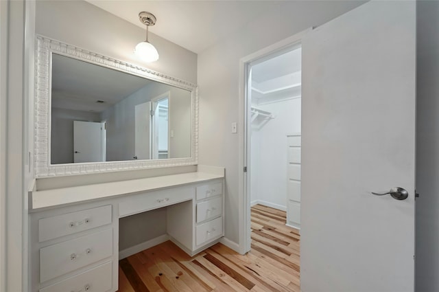 bathroom with hardwood / wood-style flooring and vanity